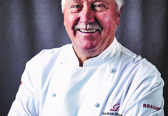 Chef Brian Turner smiling in chefs whites