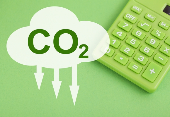 image of a calculator and a cloud saying CO2