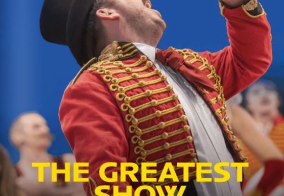 August magazine front cover a man in a red jacket singing into a mic, titled The Greatest Show